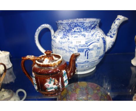 A LARGE 19TH CENTURY BLUE AND WHITE TEAPOT (no lid) a small Measham ware teapot and two similar teapots (4)