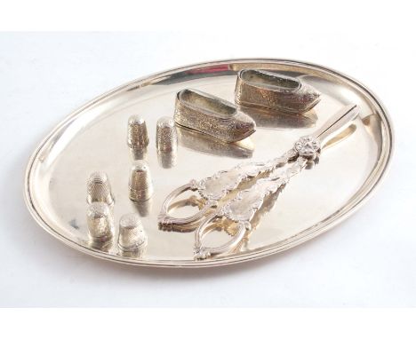 A MIXED LOT: A small, plain oval tray by R. Pringle, London 1921, a pair of grape shears, six various thimbles and a pair of 