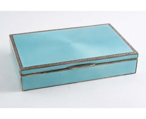 AN ART DECO CIGARETTE BOX decorated in translucent pale green over an engine-turned ground, the cover with an engraved scroll