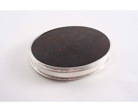 AN EARLY 18TH CENTURY OVAL SNUFF BOX with a mounted tortoiseshell cover and a stand-away hinge, unmarked, 1720-30;  3.25"  (8