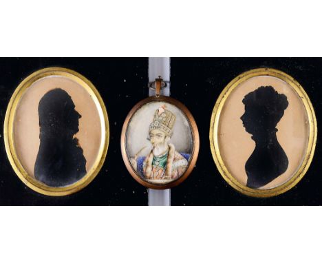 INDIAN SCHOOL 19TH CENTURY Portrait of a bearded gentleman wearing emerald & pearl jewellery & fur lined robe, head & shoulde