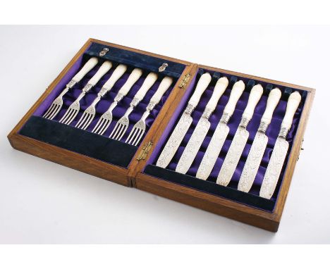 A VICTORIAN CASED SET OF SIX PAIRS OF ENGRAVED DESSERT KNIVES & FORKS with carved mother of pearl handles, by Edward Hutton, 