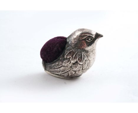 A NOVELTY PIN CUSHION in the form of a chick, maker's mark "W.J.M.& Co", Birmingham 1920;  2"  (5 cms) long
