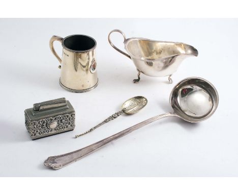 A MIXED LOT: A sauce boat, a mug with an applied enamel, Coronation badge, a small copy of the Coronation spoon, a mounted me