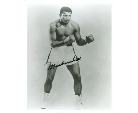 ALI MUHAMMAD: (1942-     ) American Boxer, World Heavyweight Champion. Signed 8 x 10 photograph of Ali standing in a full len