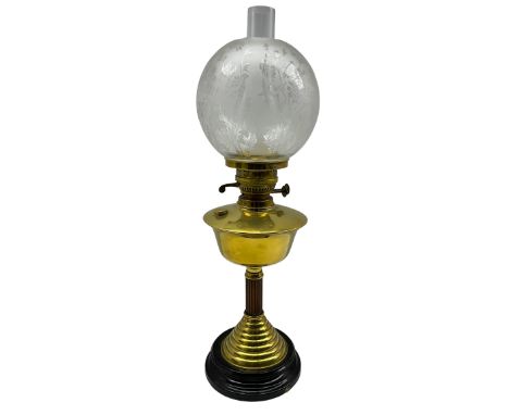 An Eltex brass column table oil lamp with etched glass shade