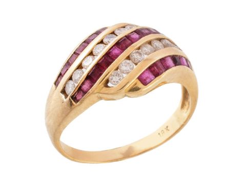 A ruby and diamond ring, set with alternating panels of square cut rubies and brilliant cut diamonds, approximately 0.28 cara