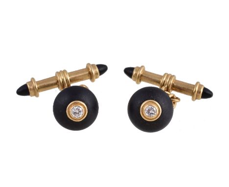 A pair of 18 carat gold, onyx and diamond cufflinks by Deakin & Francis, the circular onyx panels each set with a brilliant c