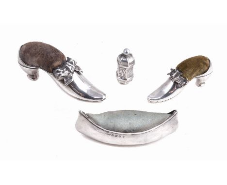 Three silver novelty pin cushions, comprising: a shoe pin cushion by Adie & Lovekin Ltd, Birmingham 1922, 8.5cm (3 1/4in) lon