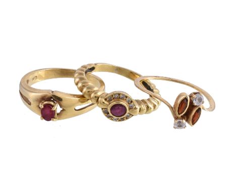 A ruby and diamond ring, the central circular cut ruby within a surround of brilliant cut diamonds, on a reeded band, finger 