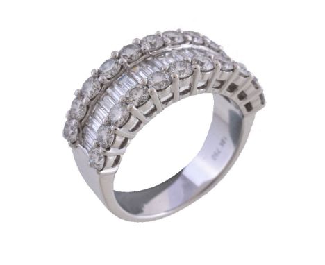 A diamond half eternity ring, the central channel set with baguette cut diamonds, between two rows of brilliant cut diamonds,