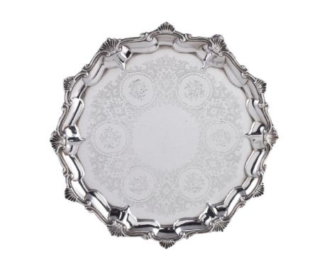 A Victorian silver shaped circular salver by Alexander Macrae, London 1859, with a shell and scroll raised rim, an engraved s