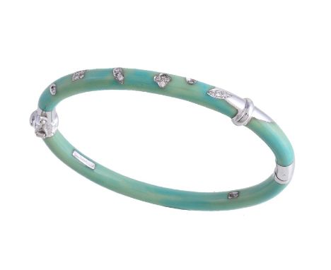 A resin and diamond hinged bangle by La Nouvelle Bague, the green resin bangle inlaid with brilliant cut diamonds, approximat
