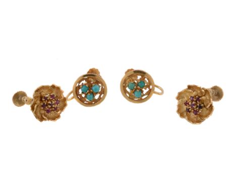 A pair of ruby flower head earrings, each earring with a central cluster of circular cut rubies, with screw fittings, stamped