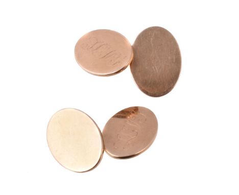 A pair of gold coloured cufflinks, the oval panels with engraved initials, with belcher link connectors, stamped 18K, 1.8cm l
