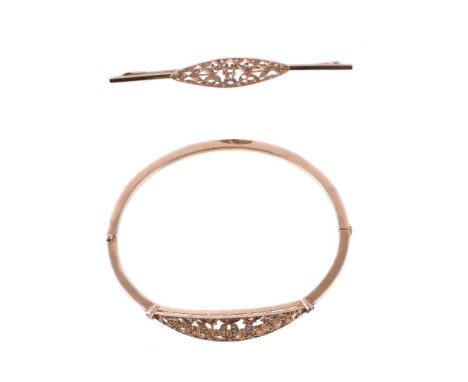 An early 20th century diamond bangle, the hinged bangle with an openwork panel spelling out the name Antonio, set with rose c