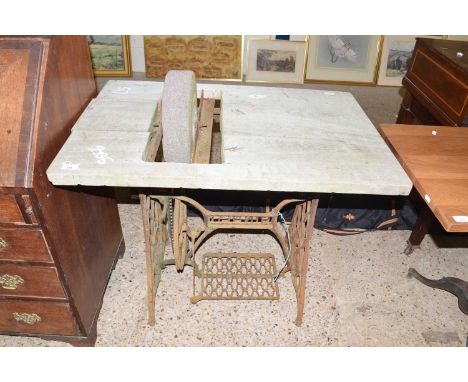 Vintage bench grinder mounted on a Singer sewing machine base