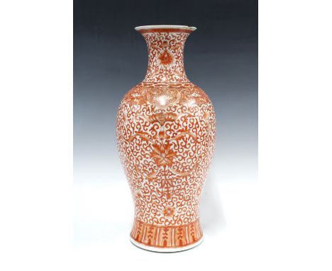 Chinese iron-red bat and lotus baluster vase, bearing an apocryphal four-character Kangxi mark, 44cm.  (small chip to rim)