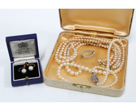 A pair of pearl stud earrings on 9ct gold posts, a triple strand Ciro necklace with 9ct gold clasp fastening, a seed peal bro