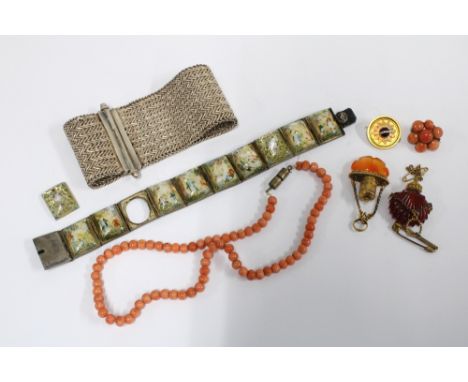 Vintage coral to include a small brooch and a strand of beads together with two small scent bottle pendants, an unmarked yell