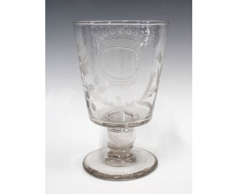 A large early 19th century goblet with a 1787 coin in the stem, with etched monogram J.M.C 1830 surrounded by flowers and thi