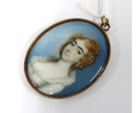 Portrait miniature on ivory, in the manner of Andrew Plimer, showing a  woman with ringlets in her hair and wearing a lace ed