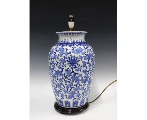 A large blue and white baluster table lamp, on wooden base, 51cm