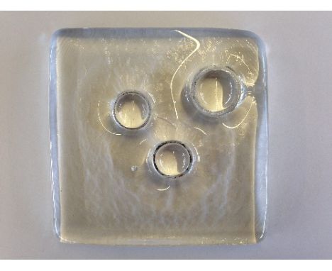 A Whitefriars glass Architectural slab No 4, designed by Geoffrey Baxter, cast with three circles (Ref. p.35 1969 Whitefriars