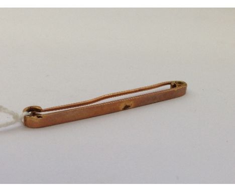 A 15 carat gold tie pin (3.5 grams).