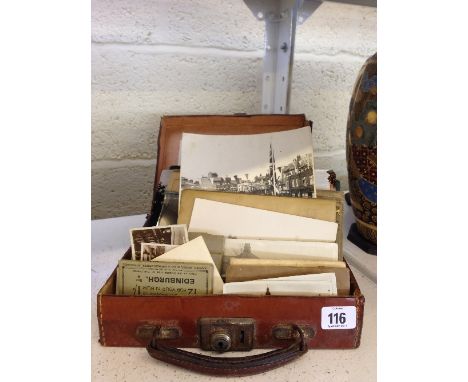 A small leather suitcase containing a quantity of ephemera including photographs relating to W J Stickland Wholesale Confecti