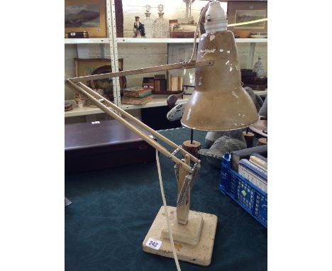 A Herbert Terry cream painted angle poise table lamp.