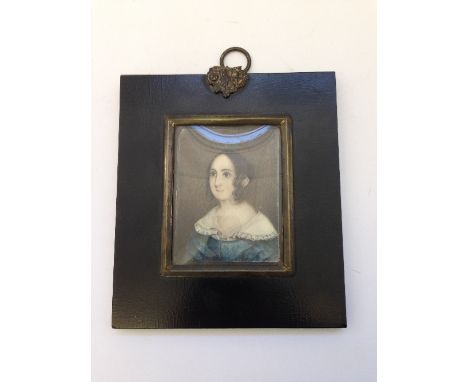 A framed and glazed miniature on paper: Woman in blue dress with white collar, purporting to relate to a local lady from Pool