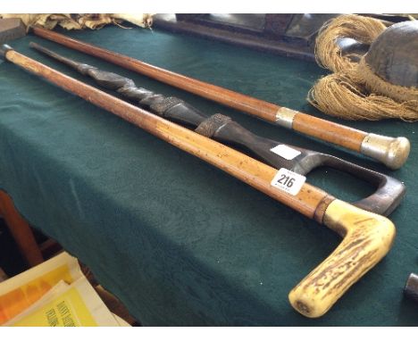 A 19th century sword stick with silver mount and engraved blade by Henry Wilkinson together with a horn handled walking stick