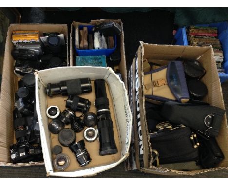 Four boxes of cameras and camera related items.