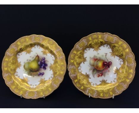 A pair of Royal Worcester porcelain dessert plates, decorated with Peaches and Cherries and Pears and Grapes by Richard Sebri