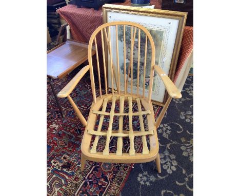 A beech framed stick back Ercol armchair.