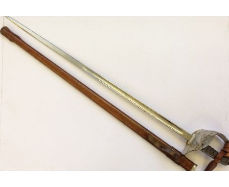 A WWI Infantry Officer's sword by Henry Wilkinson in original leather scabbard with wire bound grip, originally owned by  G R