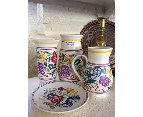 Four various white bodied Poole Pottery items.