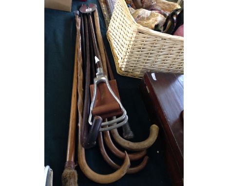 A collection of walking sticks including silver mounted together with a shooting stick.