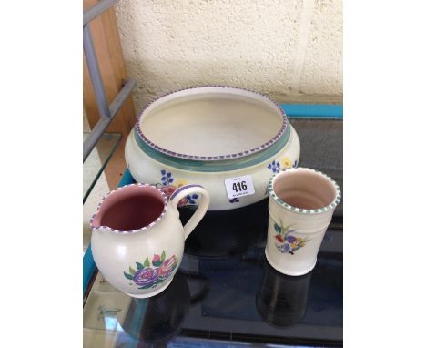 A Carter Stabler Adams Limited Poole Pottery fruit bowl, decorated in the K pattern together with a small jug and spill vase.
