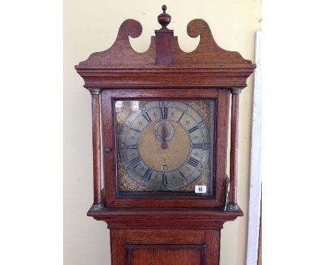 An early 18th century 30 hour oak longcase clock with silver and gold metal dial, inscribed James Pitts, Wareham.