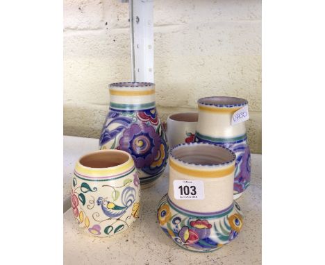 Five various Poole Pottery items.