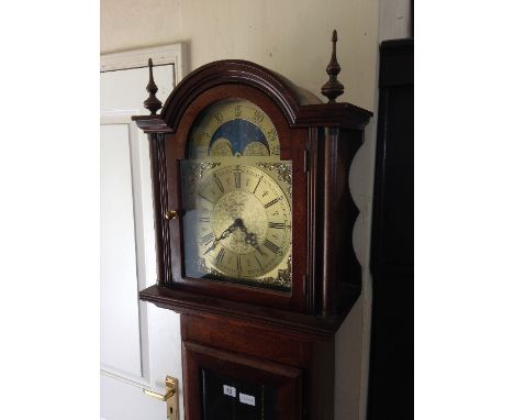 A 20th century mahogany period style longcase clock with arched dial and moonphase by Fenclocks, Suffolk.