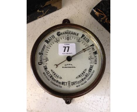 An early 20th century brass framed ship's barometer, inscribed Mann Gloucester.