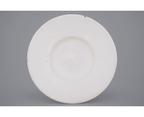 A large white monochrome Delftware dish, 17/18th C. -  Dia.: 36 cm  Probably of French origin. - Condition reports and high r