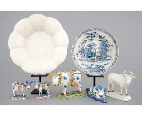 A collection of Dutch Delftware: a monochrome white dish, a cardinal's dish and 5 cows, 17/19th C. -  Dia.: 38 cm (plate) H.: