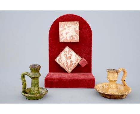 Two medieval tiles and two late medieval candlesticks, 16/17th C. -  Dim.: 7,5 x 7,5 cm   (tile)  H.: 10 cm (candlestick) - C
