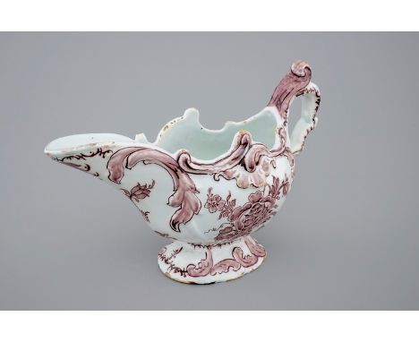 A manganese Dutch Delftware sauceboat, 18th C. -  Dim.: 23 x 14,5 cm Marked HB on the base for Hugo Brouwer, the ""De Drie Po