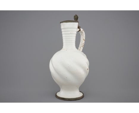 A large white Delft pewter-mounted jug with rope twist handle, 17th C. -  H.: 35 cm A somewhat smaller jug of exactly the sam