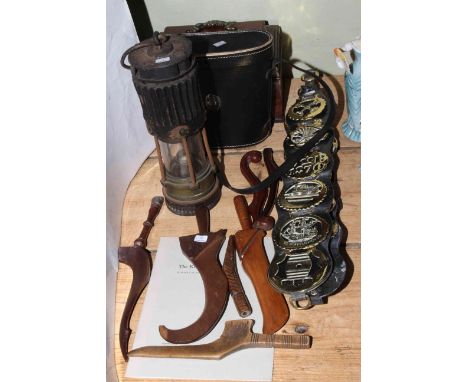 Collection of horsebrasses, antique knitting sheathes, oil lamp, binoculars and a mahogany tea caddy.